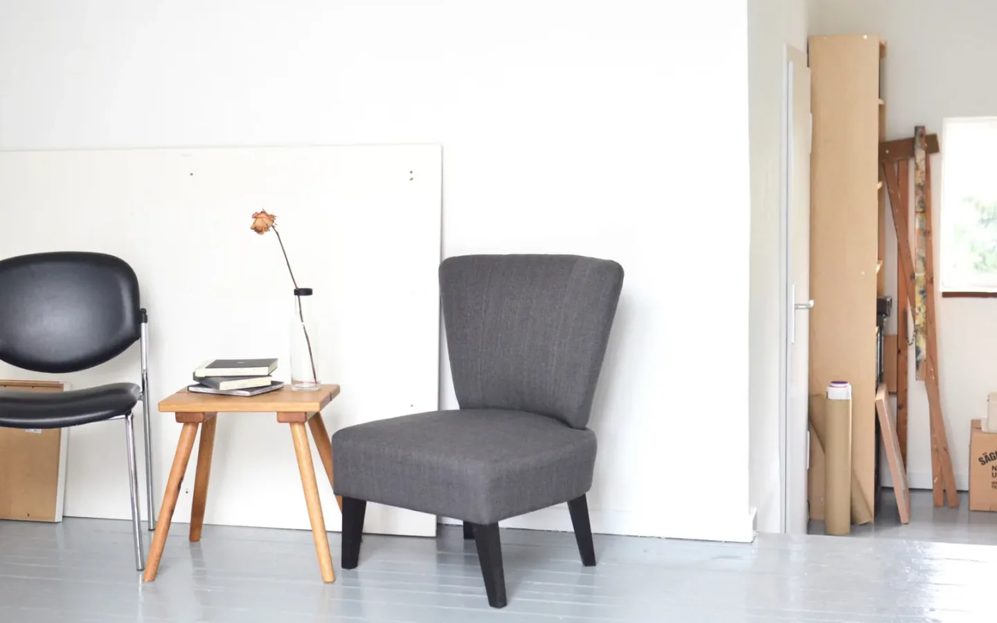 Commercial wooden dining tables and seating arranged in a modern furniture showroom and workshop