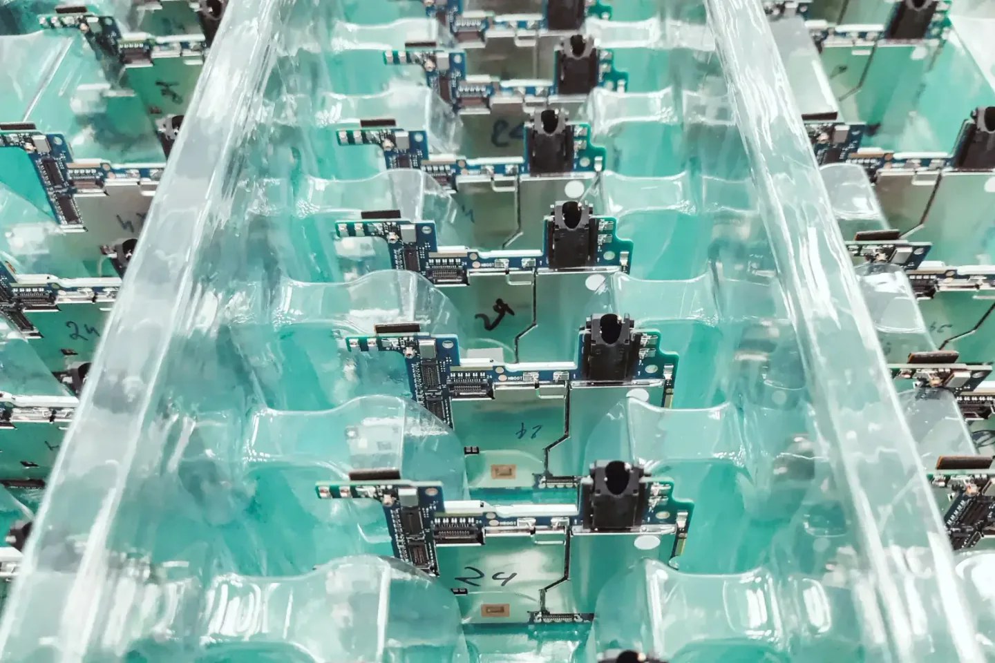 Electronic circuit assemblies arranged along an automated production line