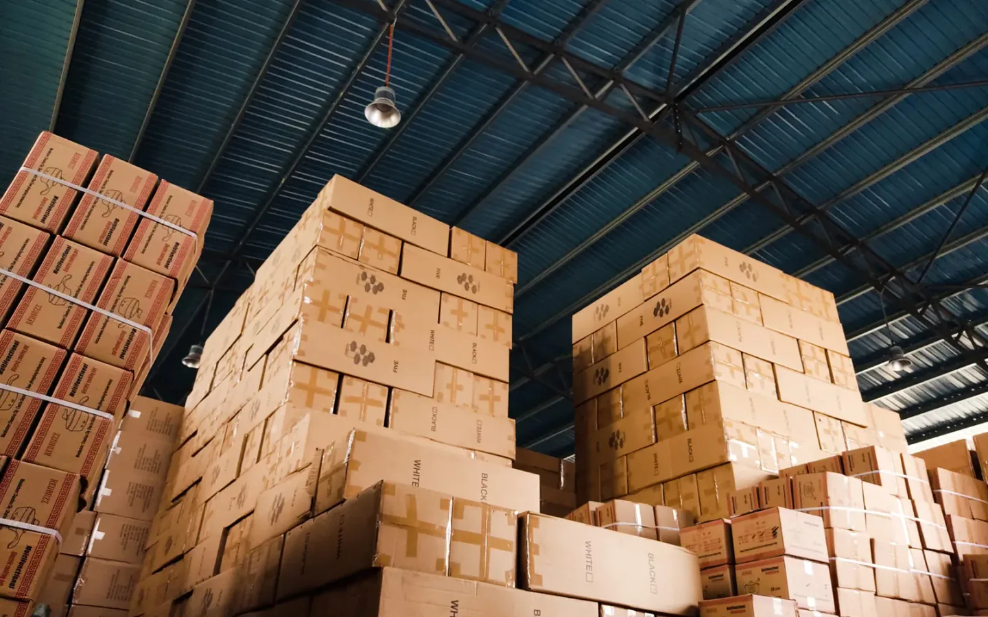 Stacks of corrugated cardboard packaging boxes prepared in a warehouse